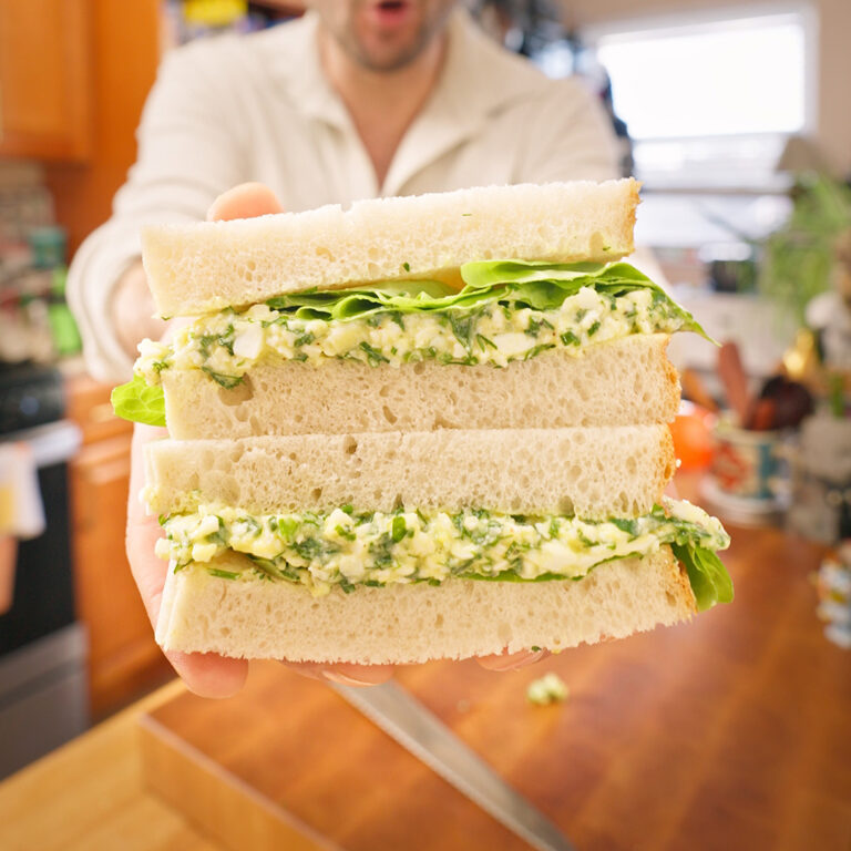 A no mayo egg salad sandwich with herbs