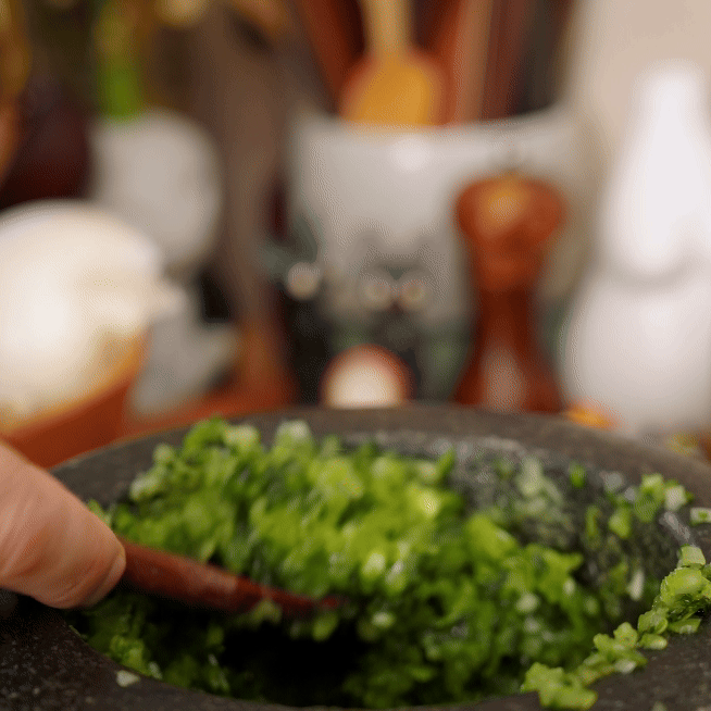 guacamole ingredients being mixed together