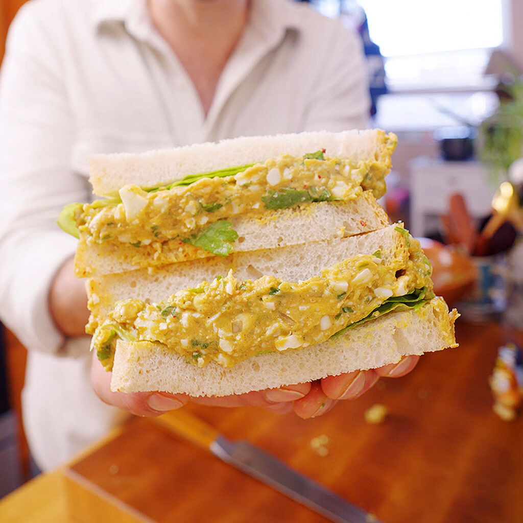 a guacamole egg salad sandwich