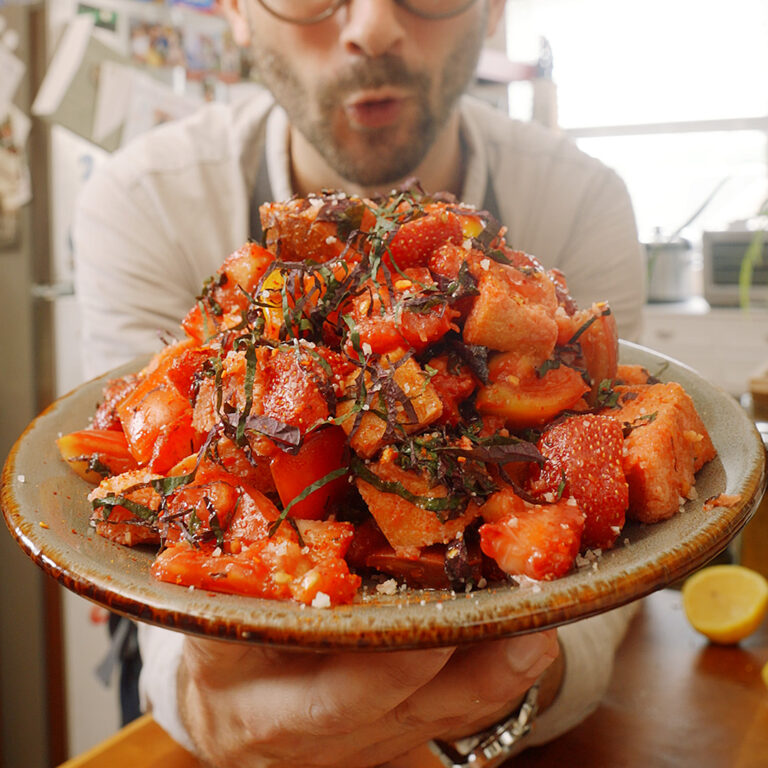A plate of strawberry, shio and tomato salad